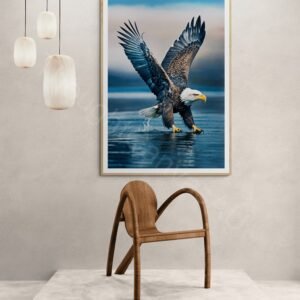 High-resolution photograph of a majestic bald eagle in flight with wings fully extended against a blurred blue background. Detailed view of the white head, dark brown feathers, and sharp yellow beak in dynamic mid-air motion.